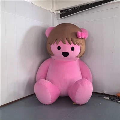 Urso rosa fofo inflável com laço